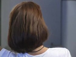 Woman with hands in hair Stock Footage