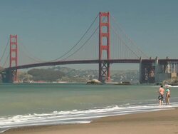 Golden Gate Bridge, Beach and Couple Stock Footage