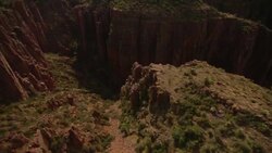 Sheer canyon walls cast shadows on the gorge below. Stock Footage