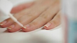 Woman applying nails polish Stock Footage