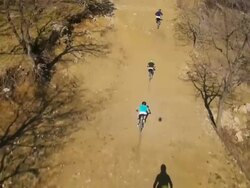 HD: Downhill Bikers Racing Along Dirt Track Stock Footage