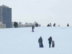 WS People sledding in urban park Stock Footage