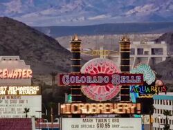 T/L, MS, Colorado Belle casino neon, Davis Dam hydro electric power generator in background, Laughlin, Nevada, USA Stock Footage