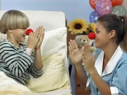 HD DOLLY: Friendly Nurse With The Red Clown Nose Stock Footage