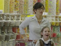 Shocked mother covering daughters eyes in candy store / Highland, Utah, United States,  Stock Footage