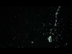 Water pouring against black Stock Footage