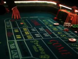 Casino footage, gambling chips and dice on craps table Stock Footage