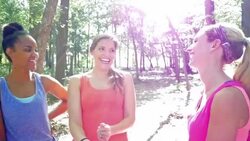 Diverse group of moms are talking while exercising together at park Stock Footage