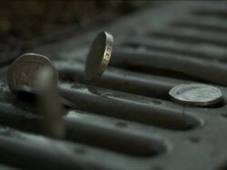 High Speed UK coins dropping onto drain Stock Footage