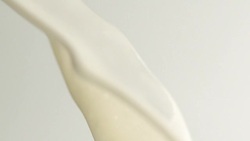 Pouring milk. Splash crown Stock Footage