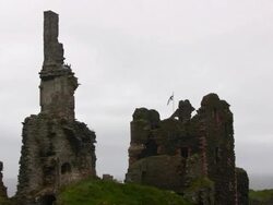 Castle Sinclair and Girnigoe with flag Stock Footage