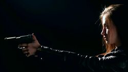 Sexy woman holding gun Stock Footage