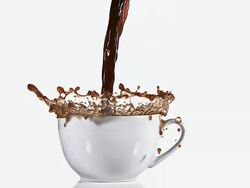 MS SLO MO Coffee pouring into bowl against white background / Vieux Pont, Normandy, France  Stock Footage