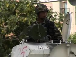 Troops mass in People's Square in central Urumqi News Clip