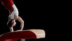 SLO MO Male gymnast doing his routine on vault Stock Footage