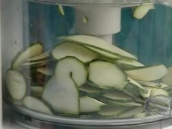 Woman cutting cucumber in blender Stock Footage