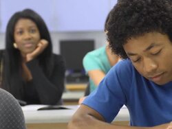 Multi-Ethnic Students in Classroom - Front focus Stock Footage
