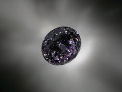 Diamond glittering as it rotates under lights Stock Footage