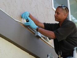 Workman Installs Home Security Camera Stock Footage