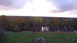 Drone aerials of a bonfire pile News Clip