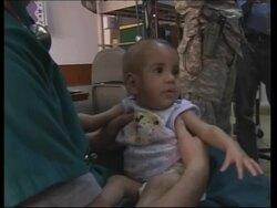 US troops care for Iraqi baby rescued from garbage News Clip