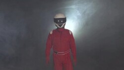 Motor racing / Formula One Driver walking through smoke with Helmet Stock Footage