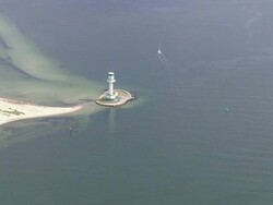 AERIAL WS ZI View of small lighthouse / Kiel Canal, Schleswig-Holstein, Germany Stock Footage