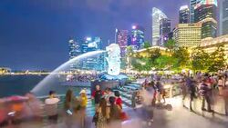 Tourists at Merlion Statue at Night, Singapore Stock Footage
