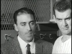 Reporters ask New York Yankees pitcher Don Larsen questions in the locker room after Larsen pitched a perfect World Series game. News Clip