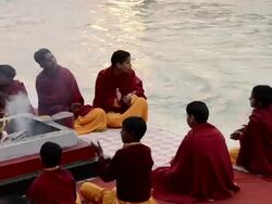 MS Pilgrims performing havan at ganges river bank / Rishikesh, Uttarakhand, India Stock Footage