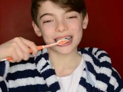 CU Shot of boy brushing teeth / London, Greater London, United Kingdom Stock Footage