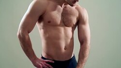 healthy athlete  with nice muscle on grey  background Stock Footage