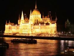 MS Boats on Danube River passing Parliament building in Budapest / Budapest, Hungary Stock Footage