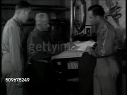1943: WWII INDUSTRY: Jack & Heintz Precision Industries founder Bill Jack looking over production charts w/ US Army officers. CU Chart w/ upward graph line. Bill talking w/ officer. Instructional Video