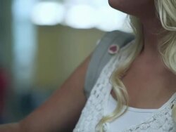 Up close slow motion of teenage girl missing part of left arm at her locker. Stock Footage