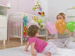 HD CRANE: Mother And Baby Playing With Balloons Stock Footage