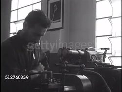 1940: VATICAN CITY MAINTENANCE: INT Machine shop warehouse, men working w/ machines, moving equipment behind delivery truck (license SCV 190), automotive repair. Instructional Video
