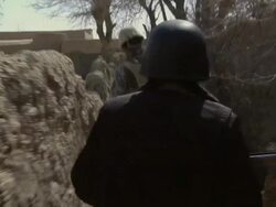 MS POV Soldier and national police walking from narrow footpath / Musa Qala, Helmand Province, Afghanistan. Stock Footage