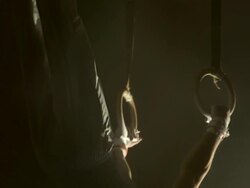 HD Super Slow-Mo: Gymnast Swinging On Steady Rings Stock Footage