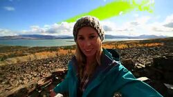 Young woman on mountain top taking selfie portrait Stock Footage