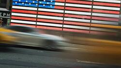 Times square american flax and taxi Stock Footage