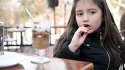 Girl eating cookie Stock Footage