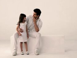 Girl whispering into her father's ear  Stock Footage