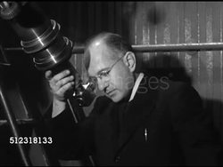 1953: GEORGETOWN UNIVERSITY: HEYDEN OBSERVATORY: VS Director Father Francis J. Heyden using telescope, adjusting upper knob, SOT saying there's Jupiter, (POV Telescope) Jupiter, unidentified male grad student using telescope. Astronomy, astronomer. Instructional Video