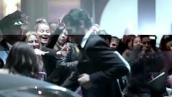 Hollywood couple climb out of limousine and greet fans on awards show red carpet at awards show Stock Footage