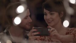 Young couple take a selfie and kiss in Austin caf_ Stock Footage