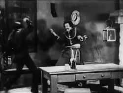 B/W 1920 Zorro (Douglas Fairbanks) cornering other man in sword fight / feature Stock Footage