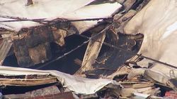 Damaged buildings still smouldering following night of protests News Clip