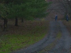 two women running down dirt road in country Stock Footage