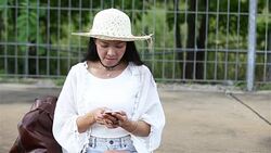 Closeup woman play her smartphone Stock Footage